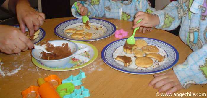 Kids Cooking - Adding chocolate to the biscuits